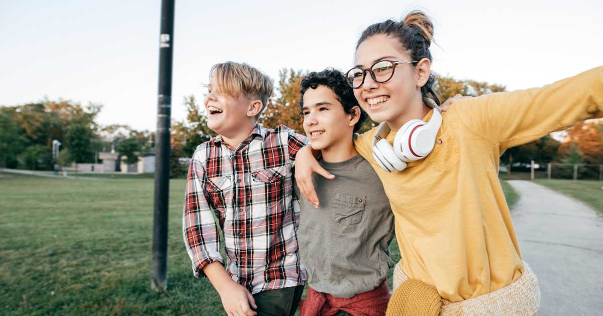 Teens smiling at each other