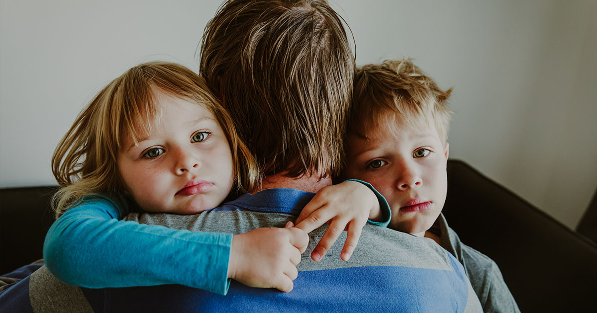 Family with 2 kids looking worried