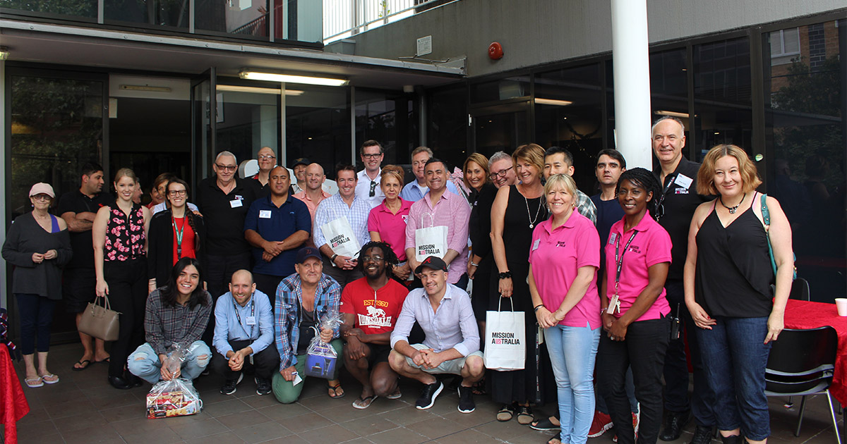 Group of people smiling in front of the MAC Surry Hills, Sydney