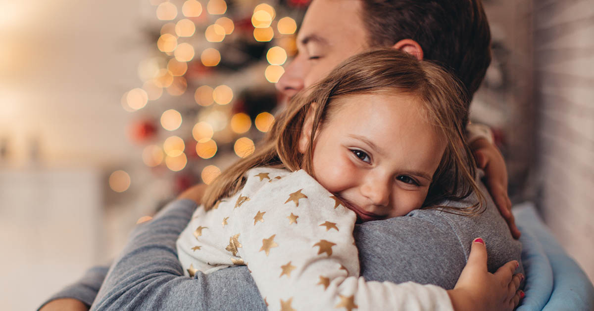 Little girl hugging father