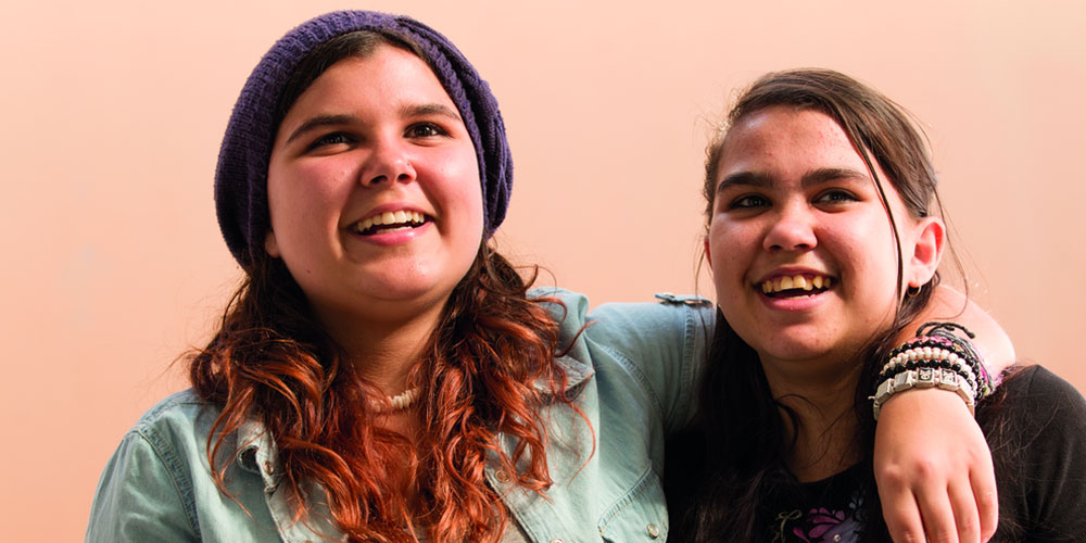 two woman looking happy