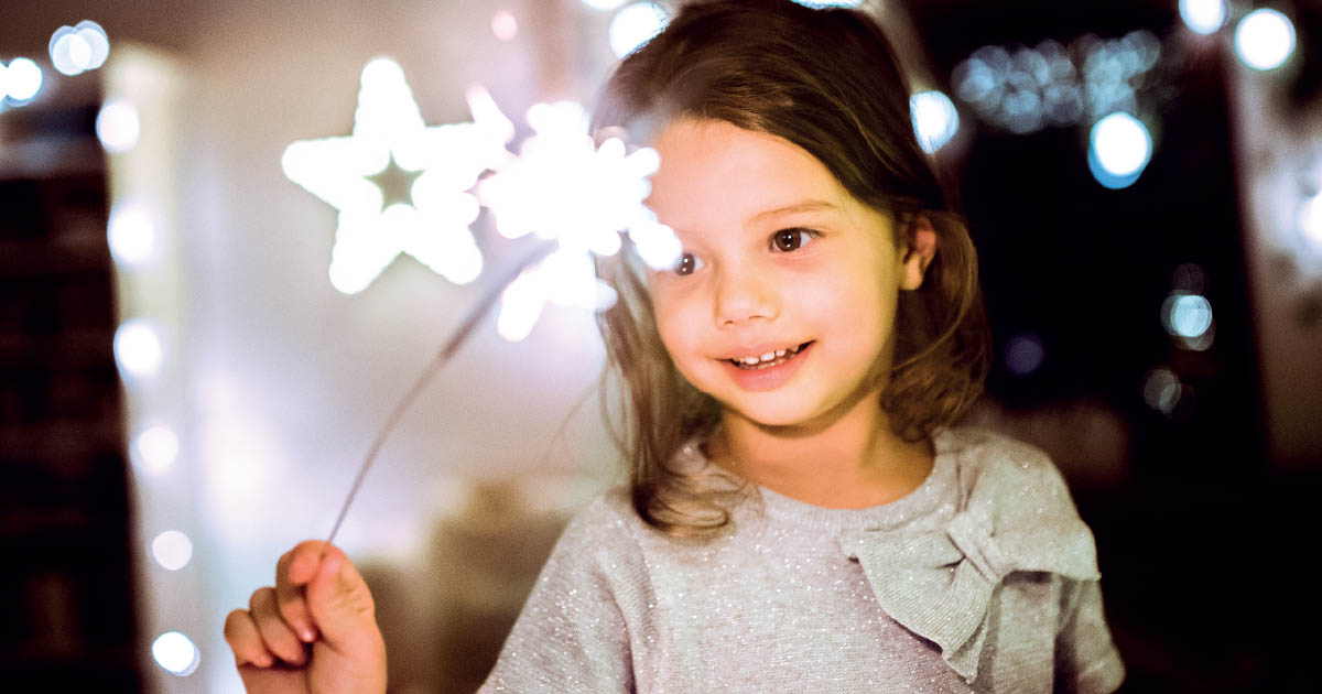 A girl looking happy celebrating Christmas