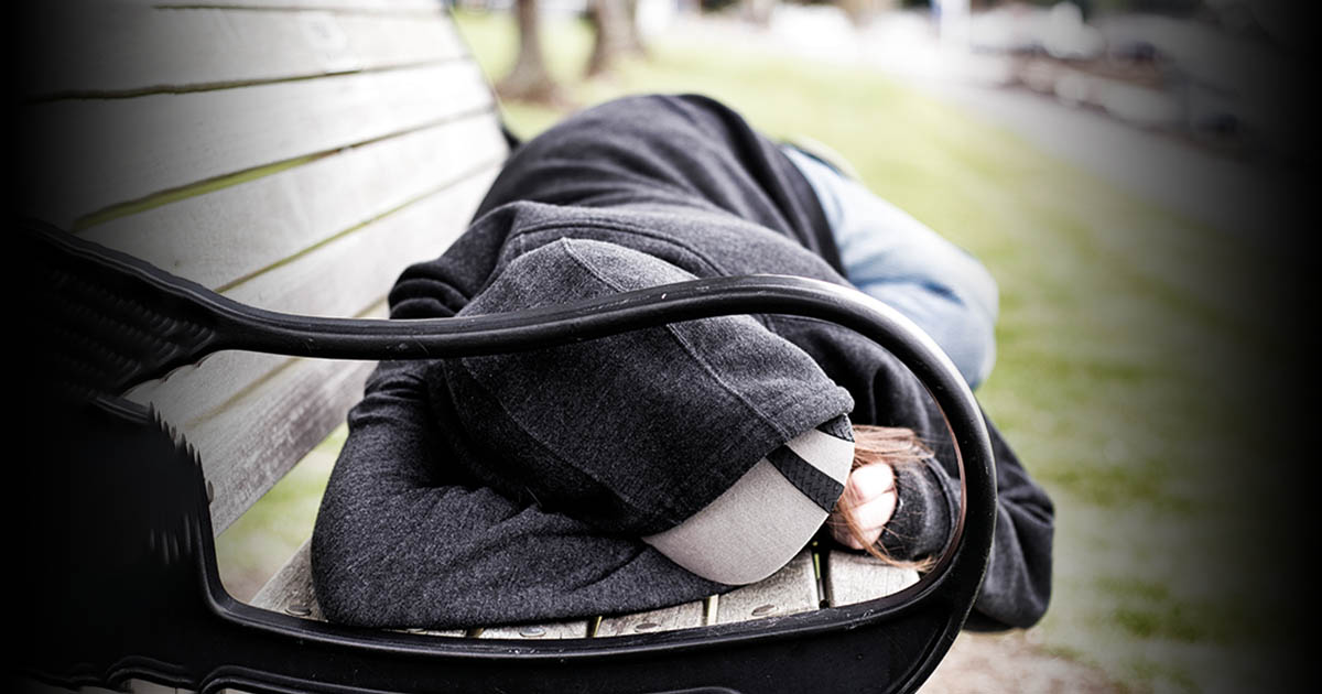 A homeless sleeping at the bench
