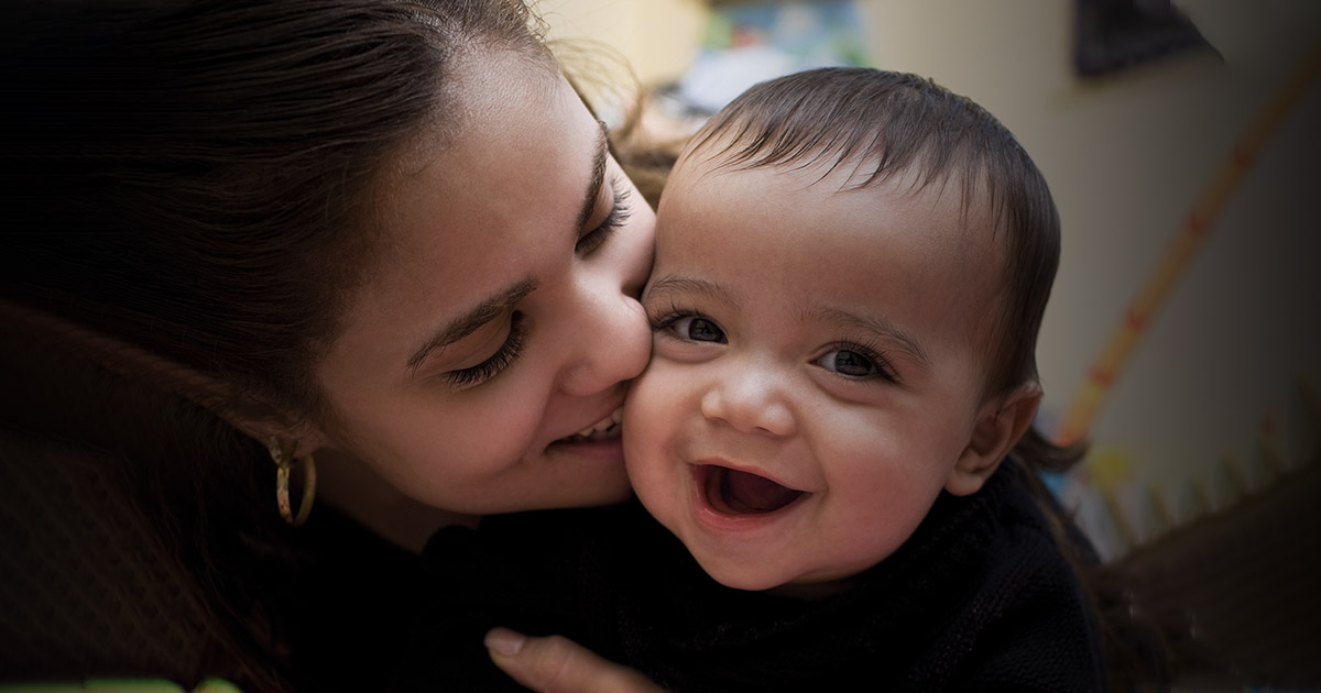 Mother and daughter looking happy together