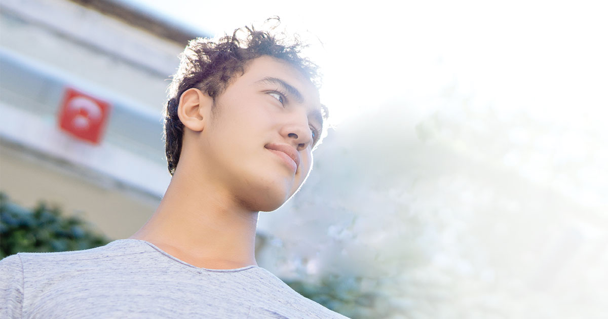 Young adult looking hopeful