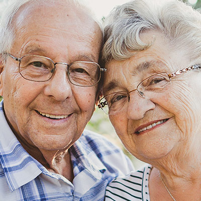 Elderly couple embracing