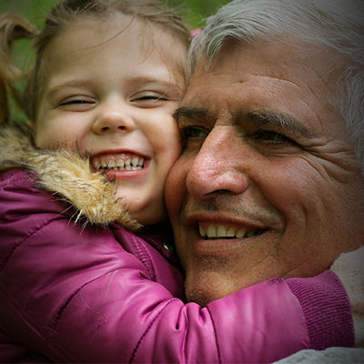 A man hugging his grandaughter